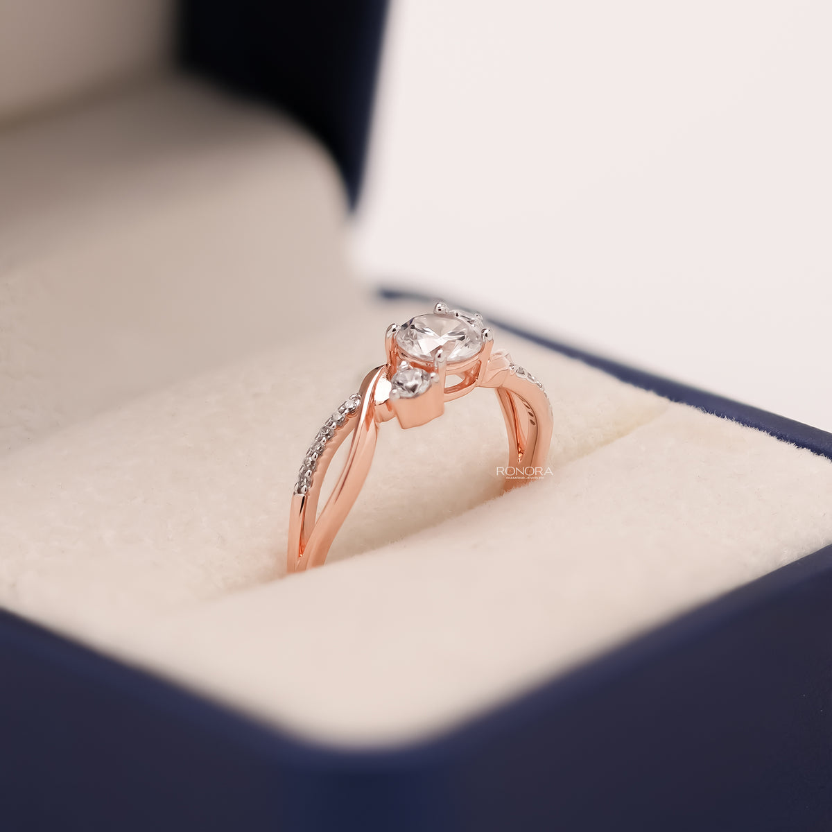 Angled view of round lab grown diamond bypass ring with pave bypass setting