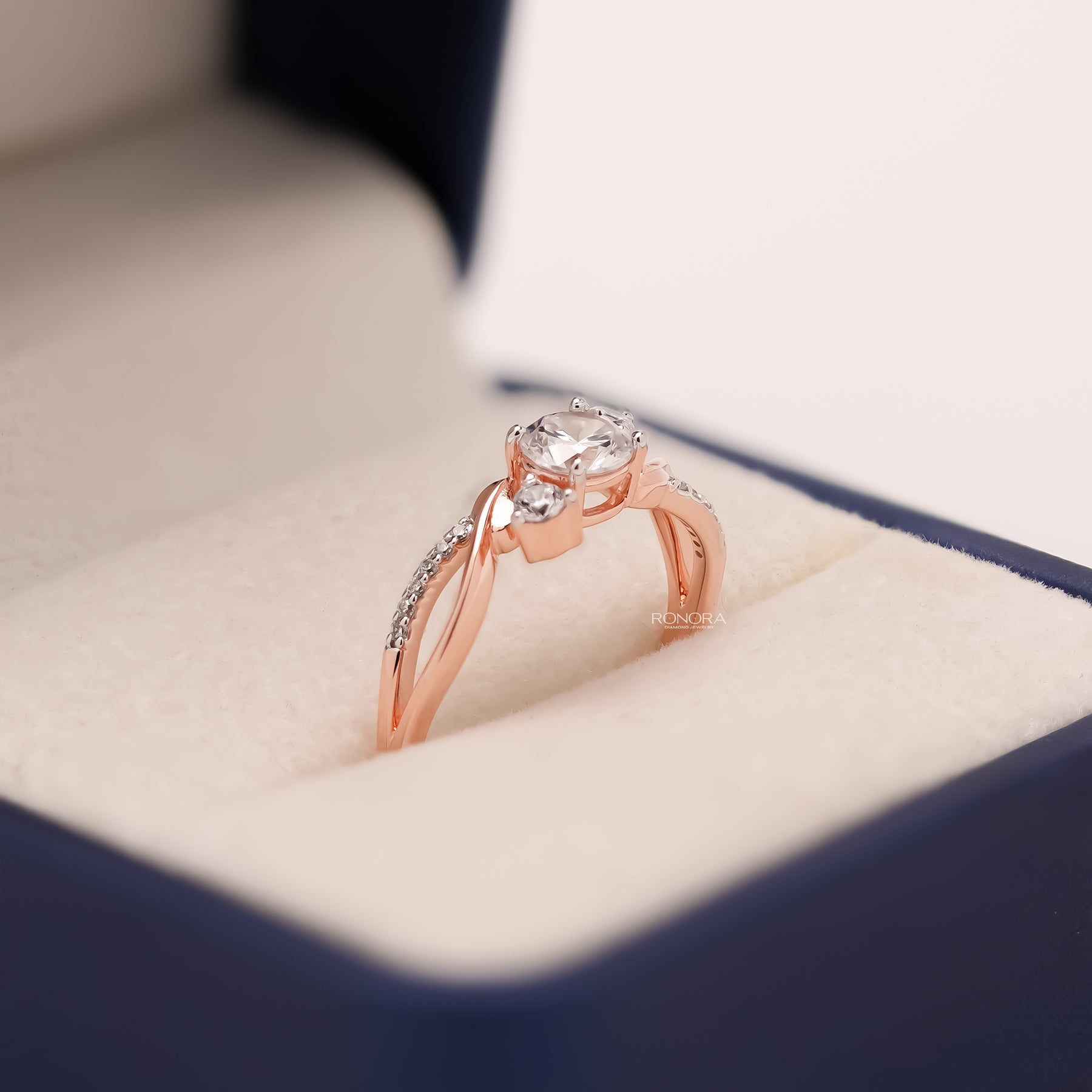 Angled view of round lab grown diamond bypass ring with pave bypass setting