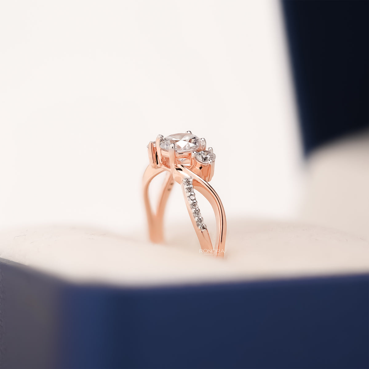 round lab grown diamond bypass ring worn with luxury styling in rose gold