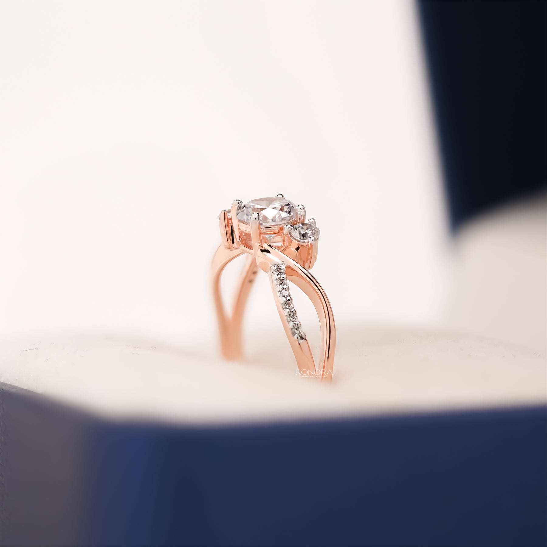 round lab grown diamond bypass ring worn with luxury styling in rose gold