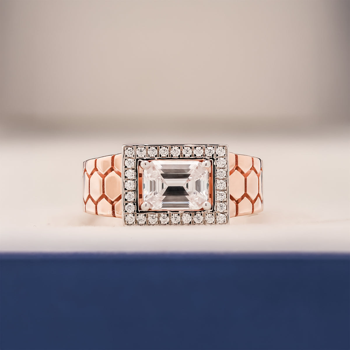 Alden emerald moissanite halo men's ring in rose gold inside Ronora box