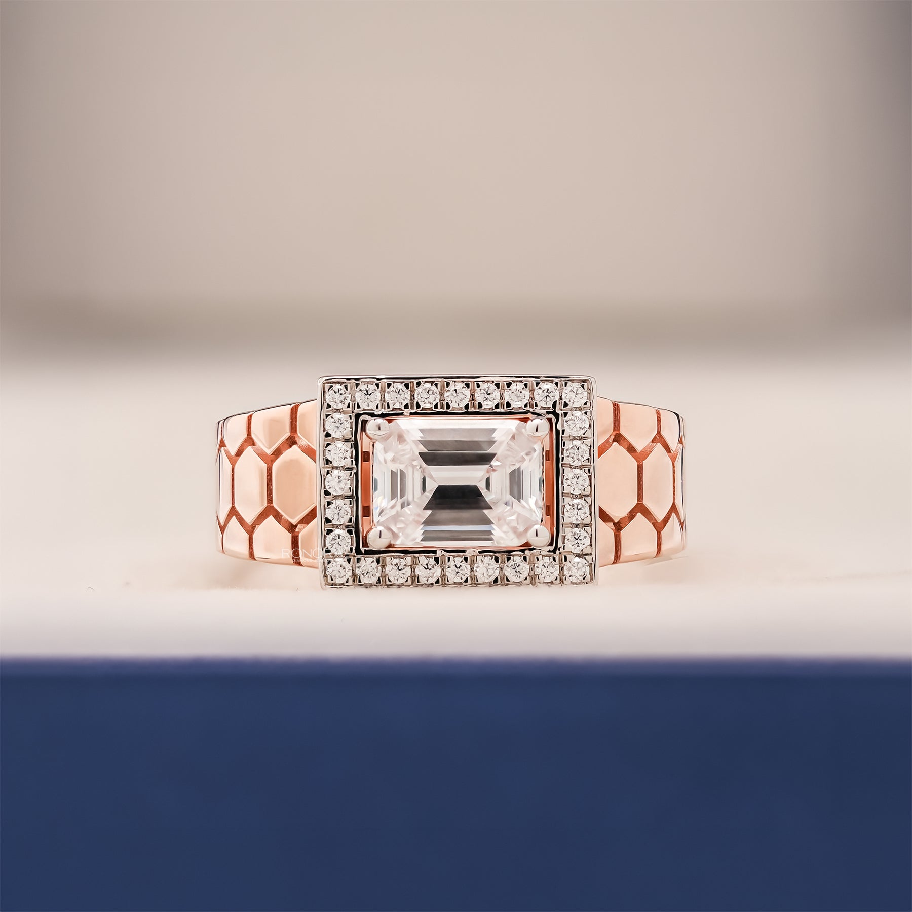 Alden emerald moissanite halo men's ring in rose gold inside Ronora box