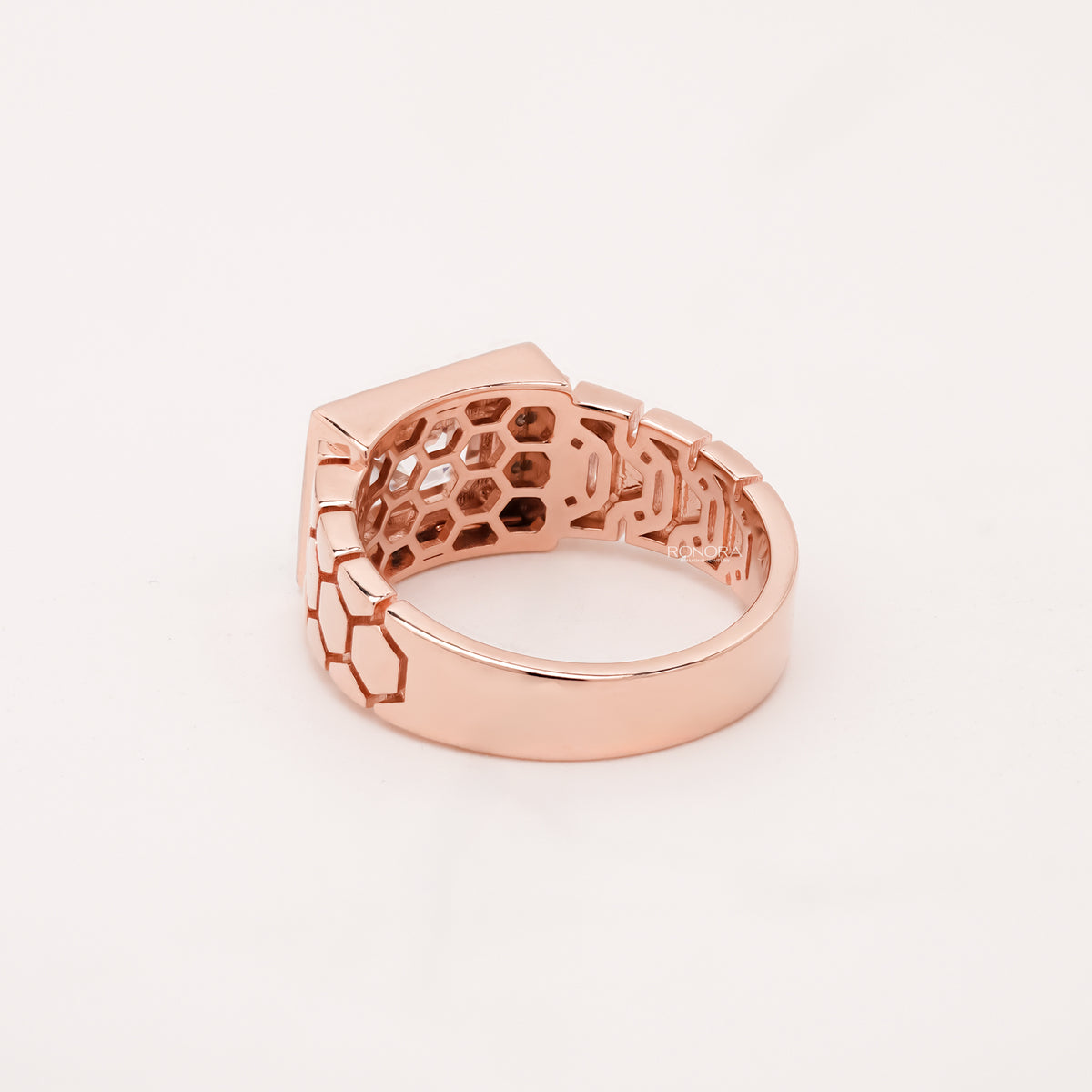 emerald moissanite halo men's ring worn with luxury styling in rose gold