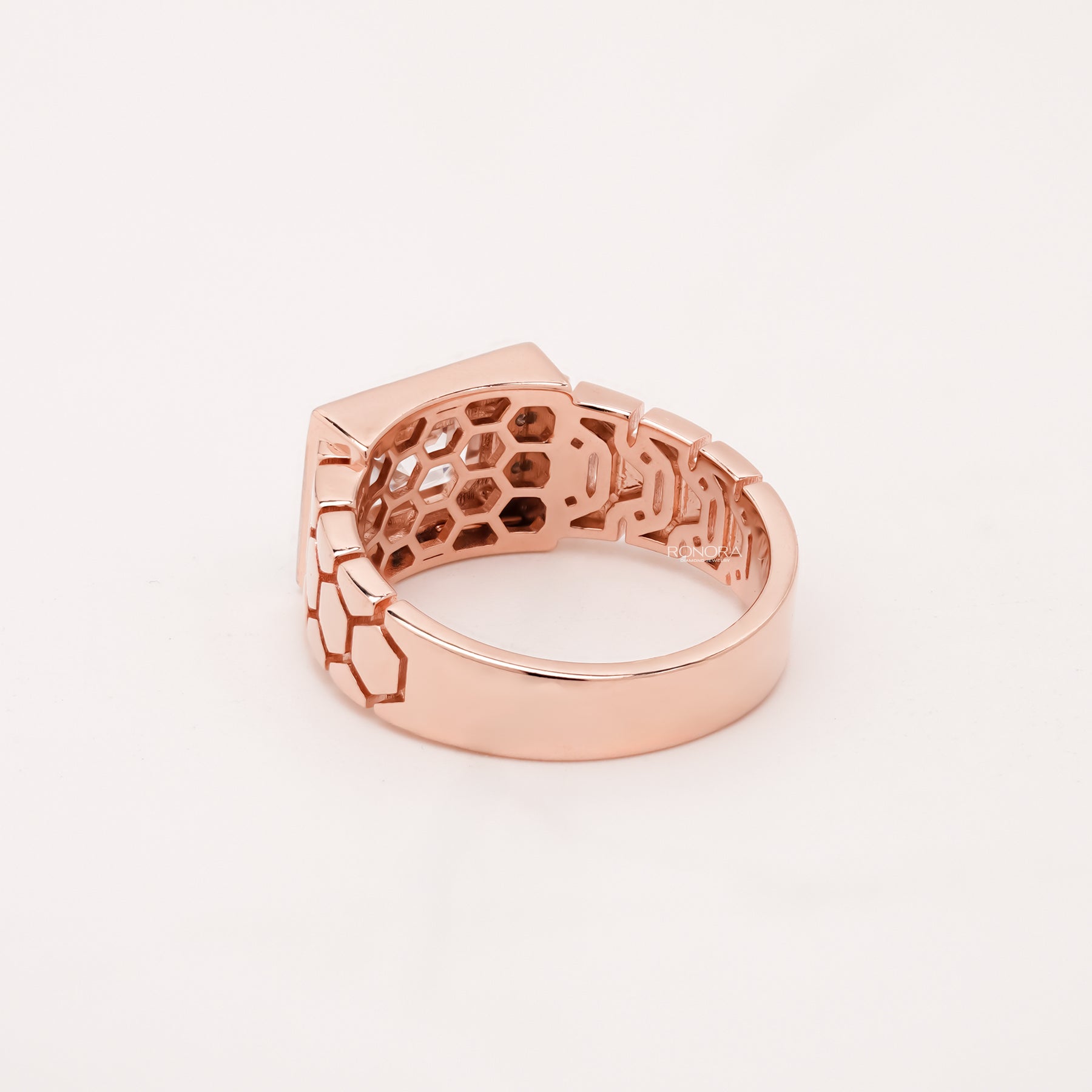 emerald moissanite halo men's ring worn with luxury styling in rose gold