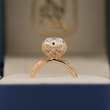 Angled view of marquise lab grown diamond vintage halo ring with vintage halo setting