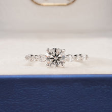 Isabelle round lab grown diamond side-stone ring in white gold inside Ronora box