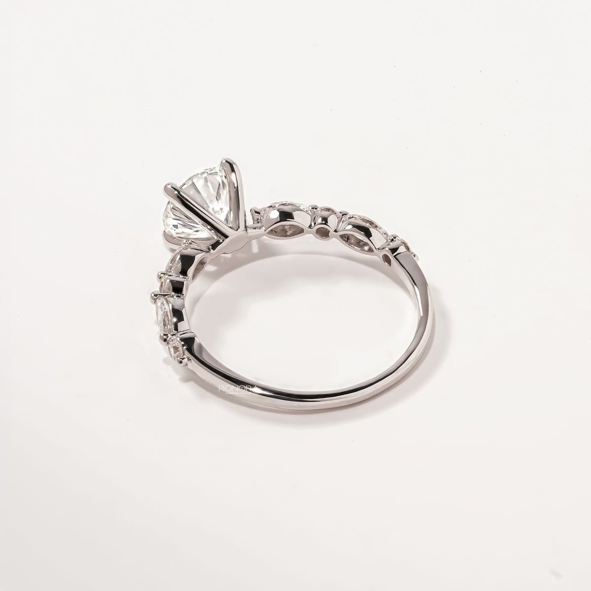 Back view of round lab grown diamond side-stone ring showing band detail