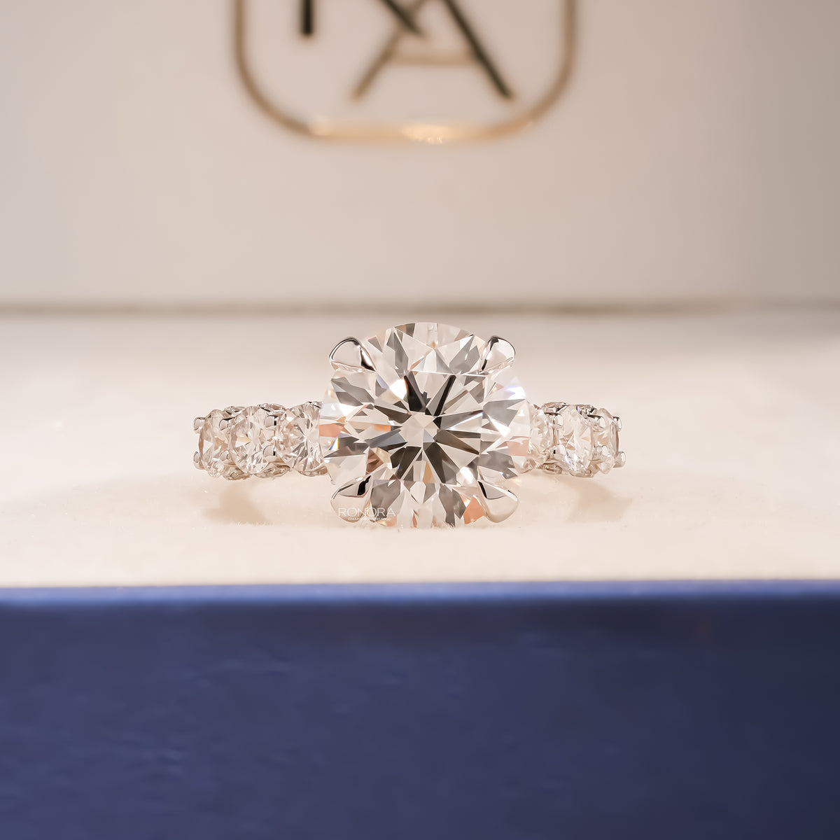 Cambria round lab grown diamond vintage halo ring in yellow gold inside Ronora box