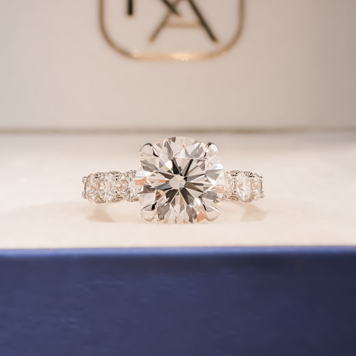 Cambria round lab grown diamond vintage halo ring in yellow gold inside Ronora box