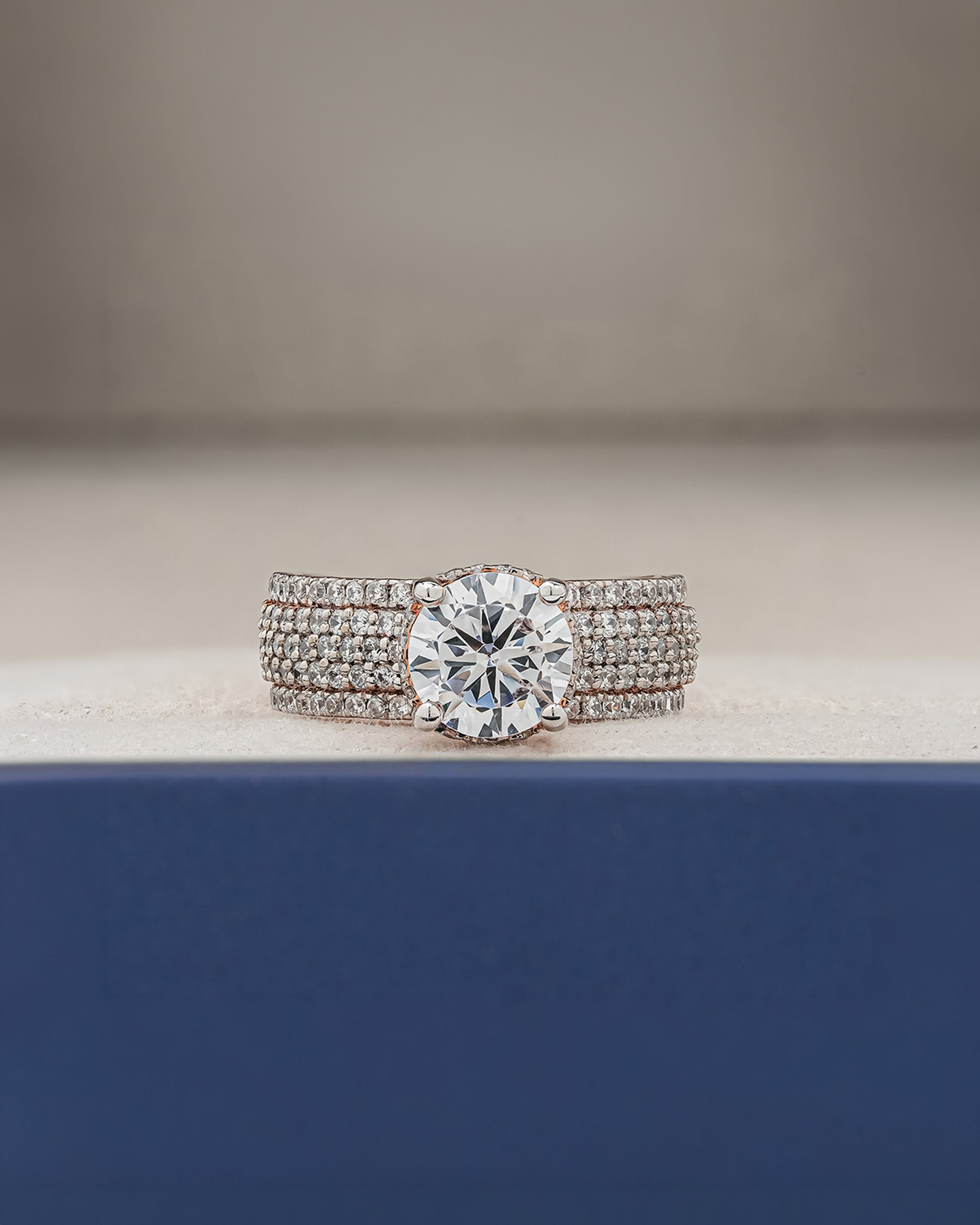 Adeline round moissanite pave ring in rose gold inside Ronora box