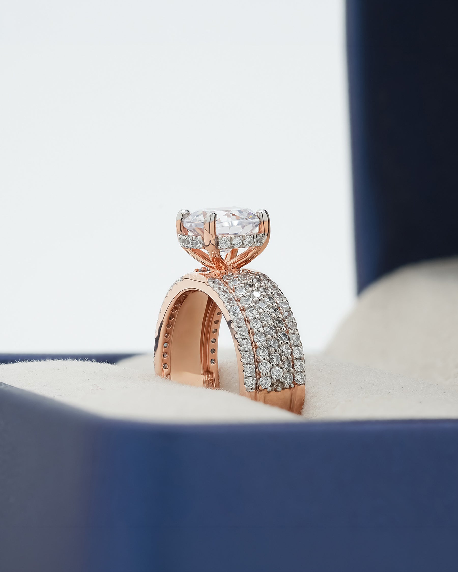 Side profile of round moissanite pave ring showing ring setting
