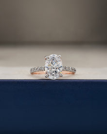 Mireya oval moissanite pave ring in rose gold inside Ronora box