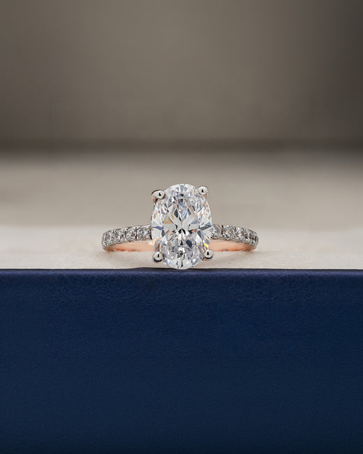 Mireya oval moissanite pave ring in rose gold inside Ronora box