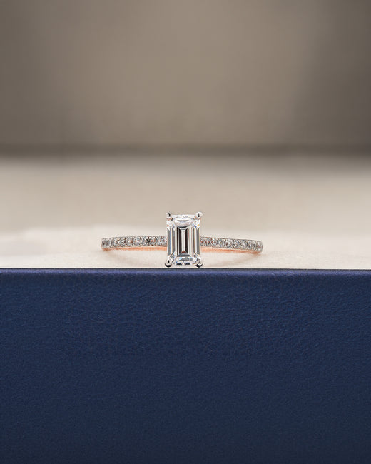 Elian emerald cut moissanite pave ring in rose gold inside Ronora box