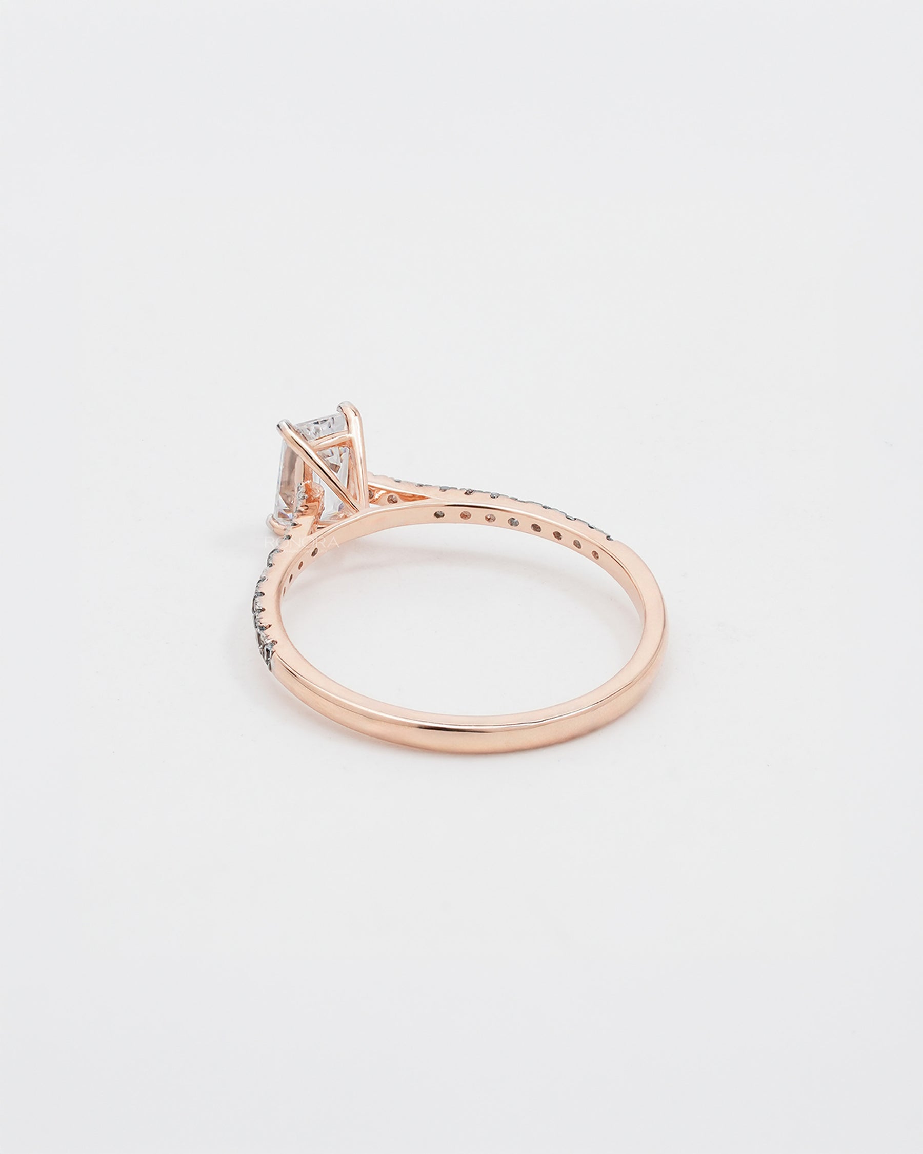 Back view of emerald cut moissanite pave ring showing band detail