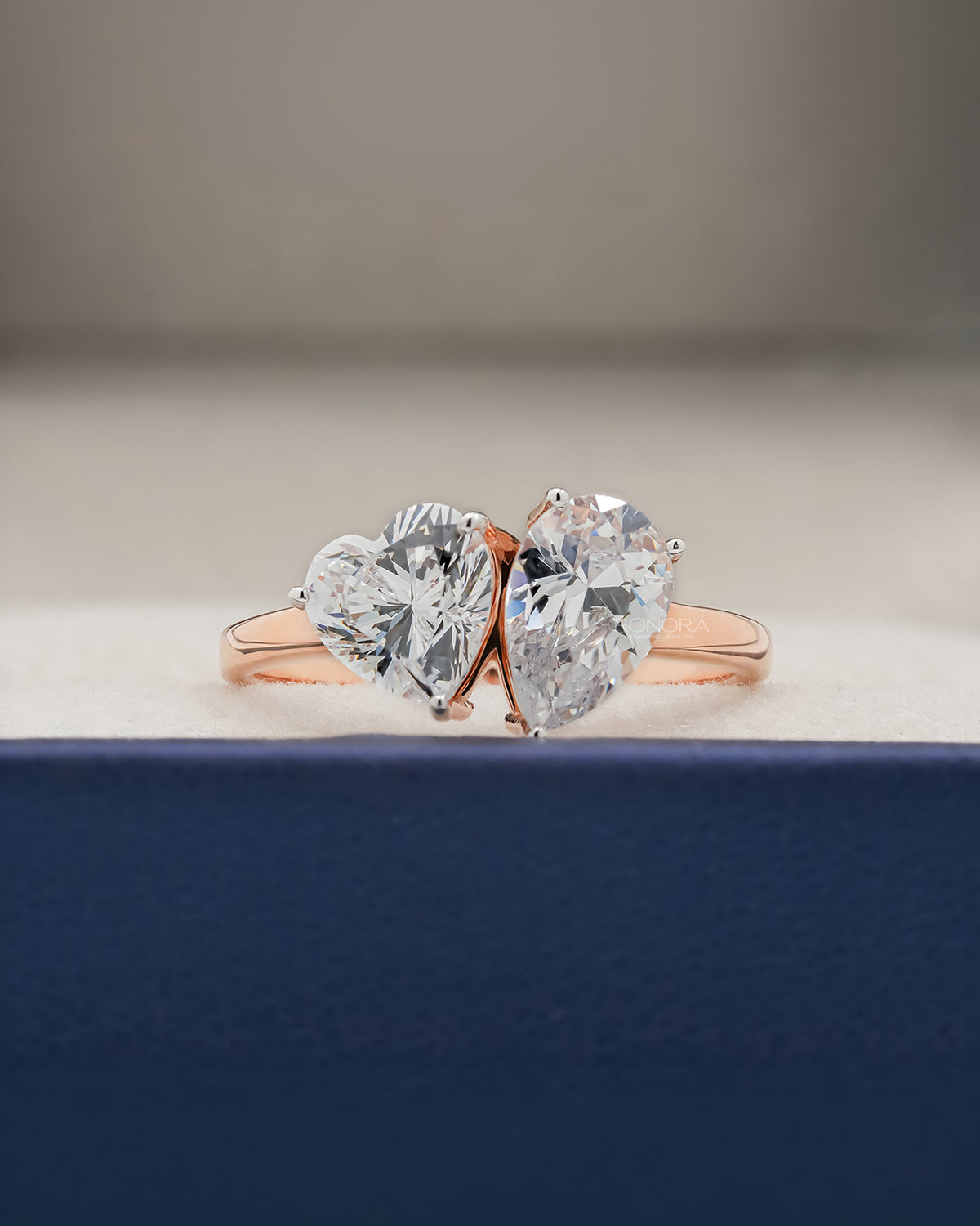 Amorette heart pear moissanite toi et moi ring in rose gold inside Ronora box