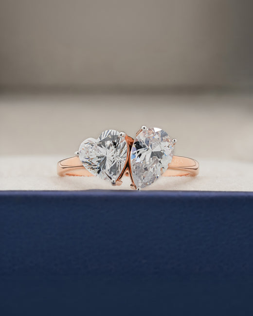 Amorette heart pear moissanite toi et moi ring in rose gold inside Ronora box