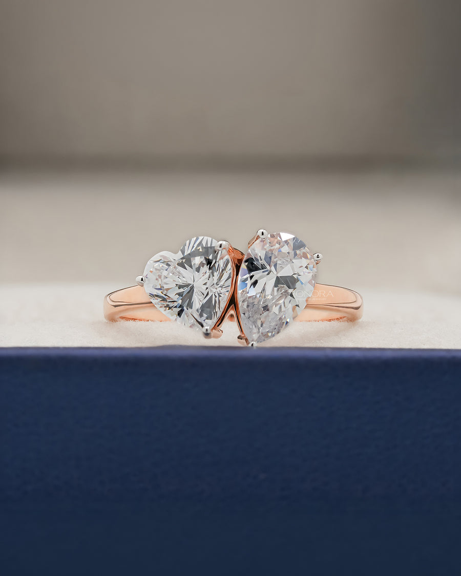 Amorette heart pear moissanite toi et moi ring in rose gold inside Ronora box