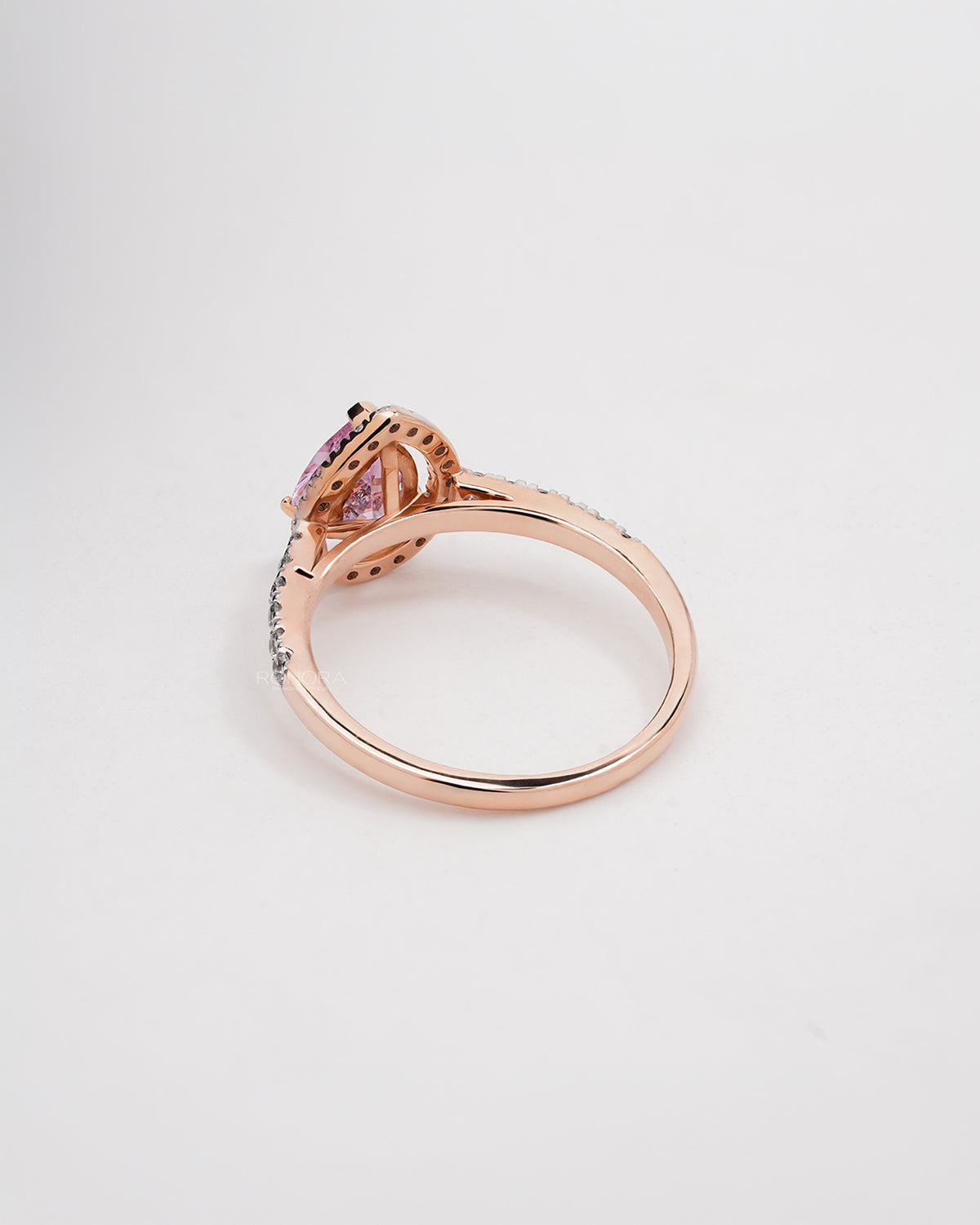 Back view of pink pear moissanite halo ring showing band detail