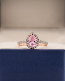Livia pink pear moissanite halo ring in rose gold inside Ronora box