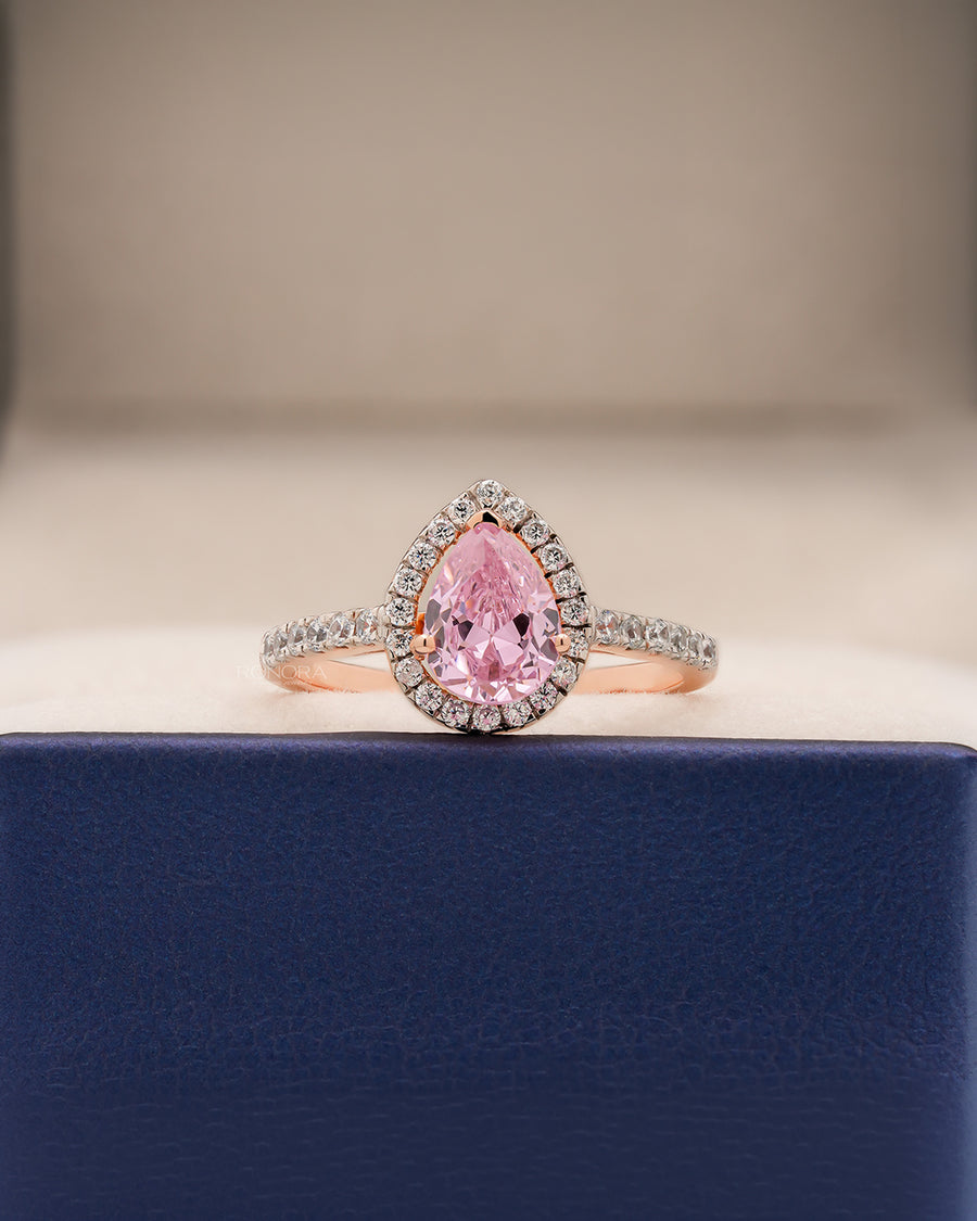 Livia pink pear moissanite halo ring in rose gold inside Ronora box