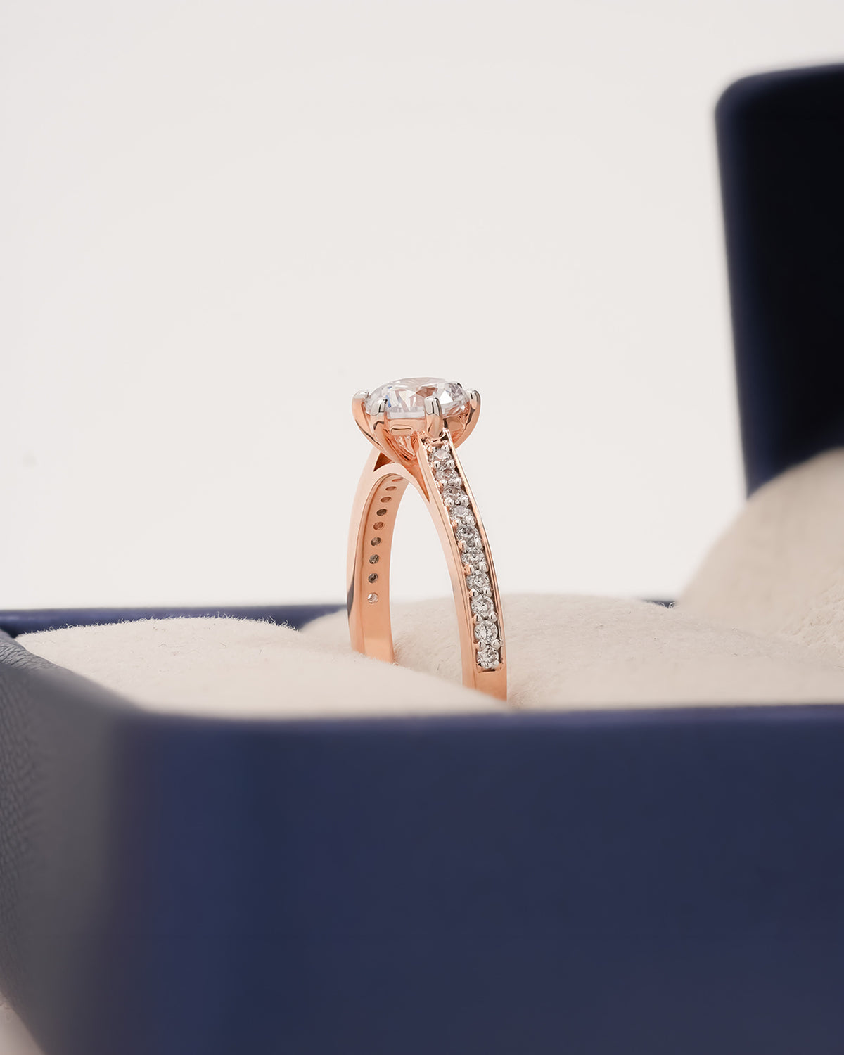 Close-up view of round moissanite pave ring showing pave setting
