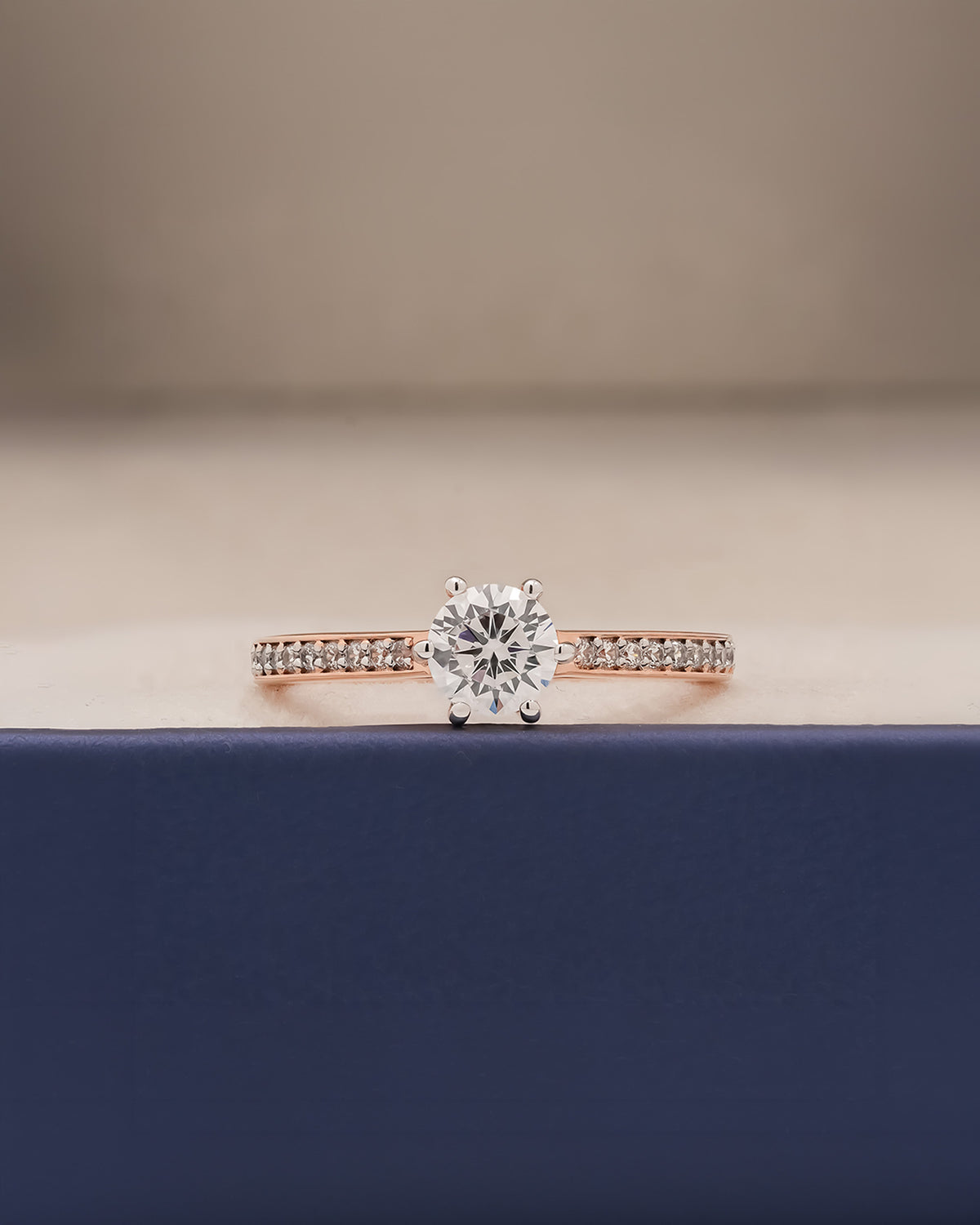 round moissanite pave ring worn on hand in rose gold