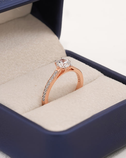 Angled view of round moissanite pave ring with pave setting