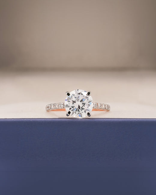 Clara round moissanite pave ring in rose gold inside Ronora box