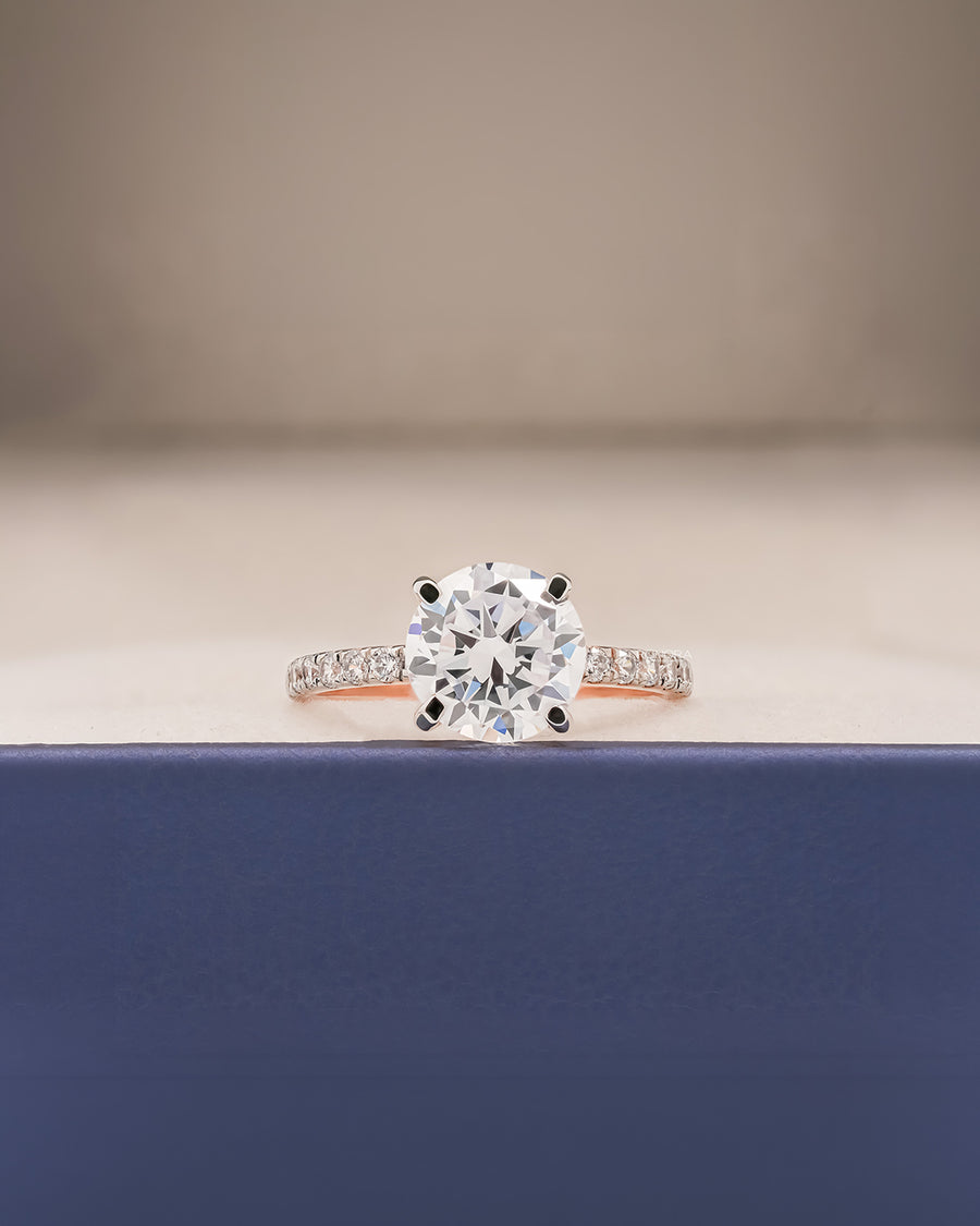 Clara round moissanite pave ring in rose gold inside Ronora box