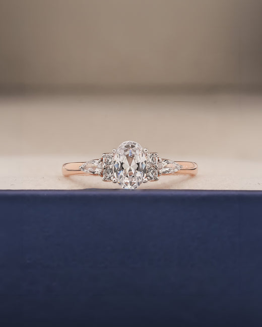 Lisette oval pear moissanite cluster ring in rose gold inside Ronora box