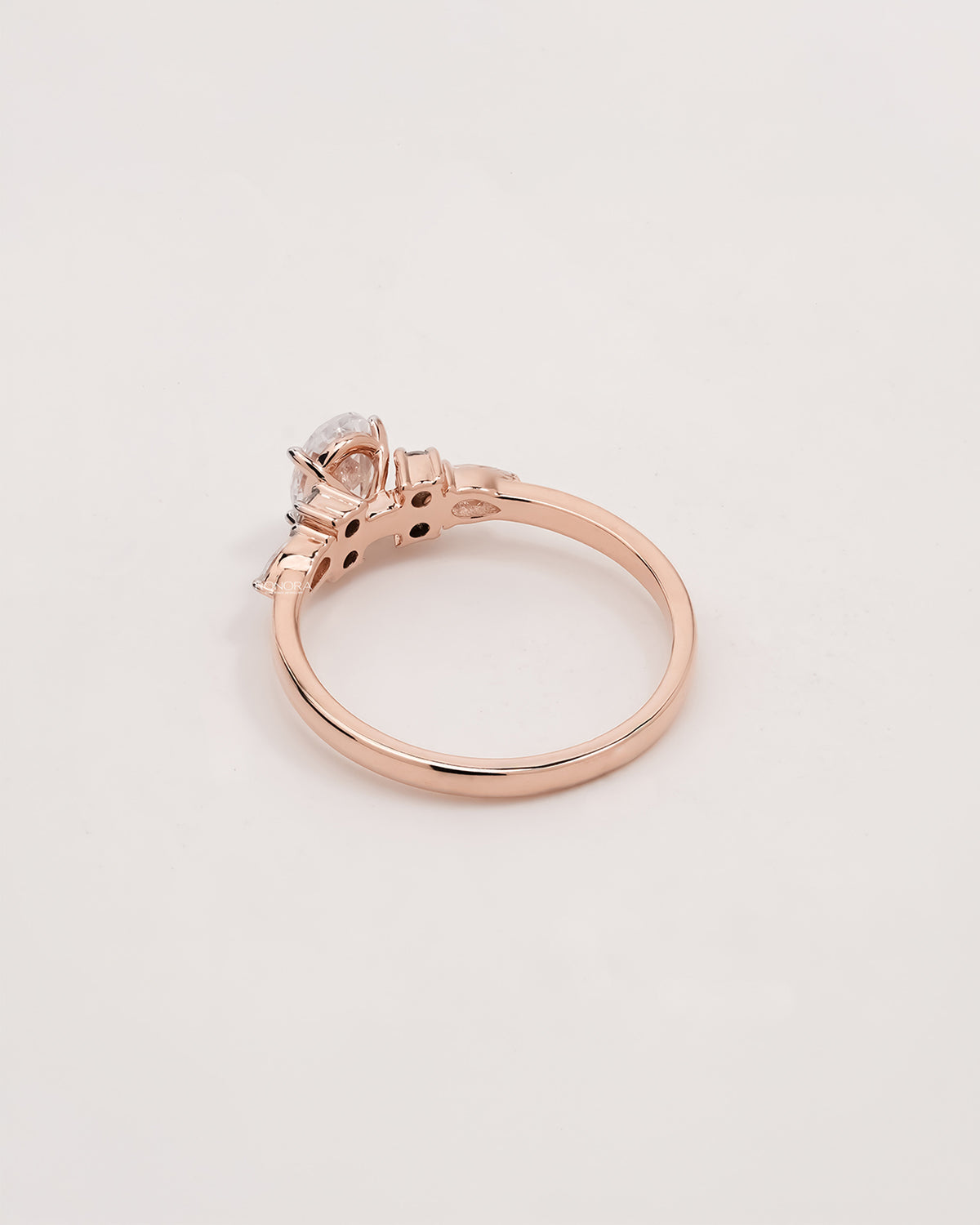 Back view of oval pear moissanite cluster ring showing band detail