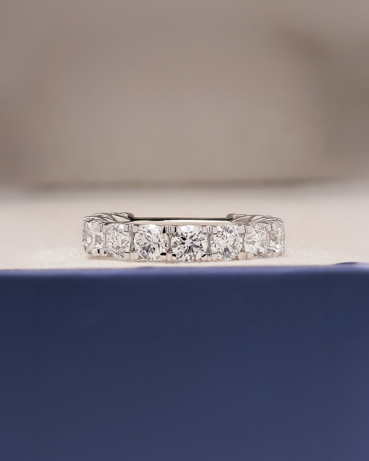 Evelina round lab grown diamond eternity band in white gold inside Ronora box