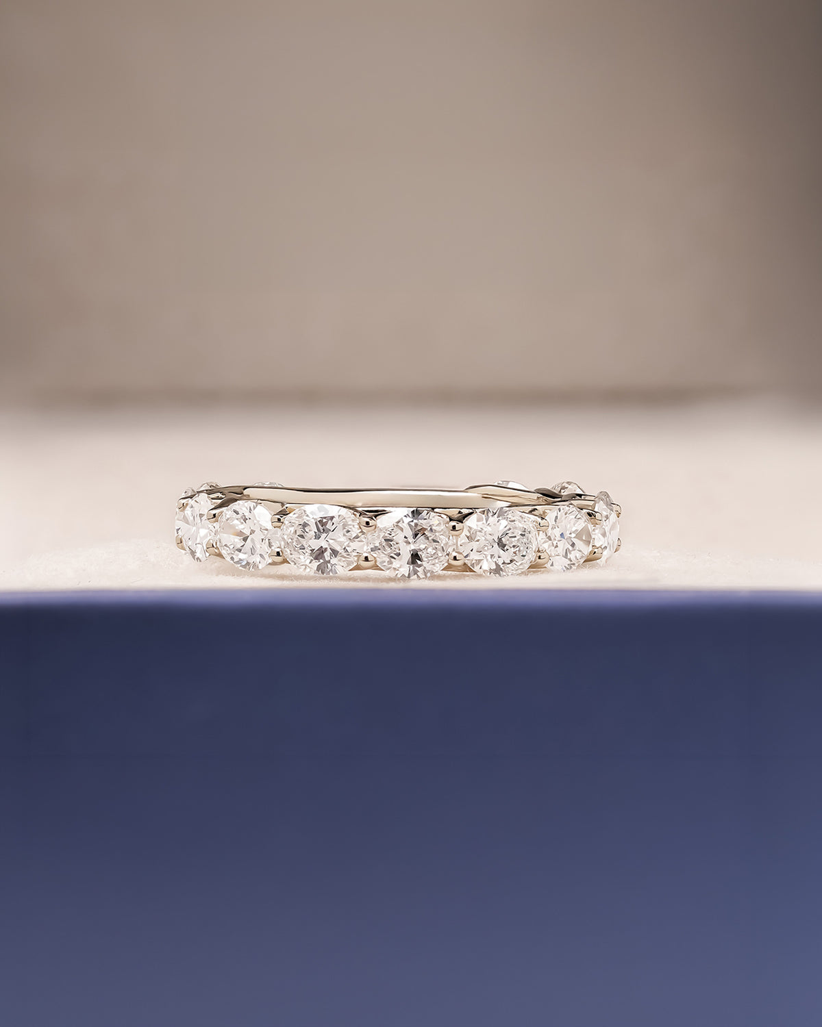 Margaux oval lab grown diamond eternity band in white gold inside Ronora box