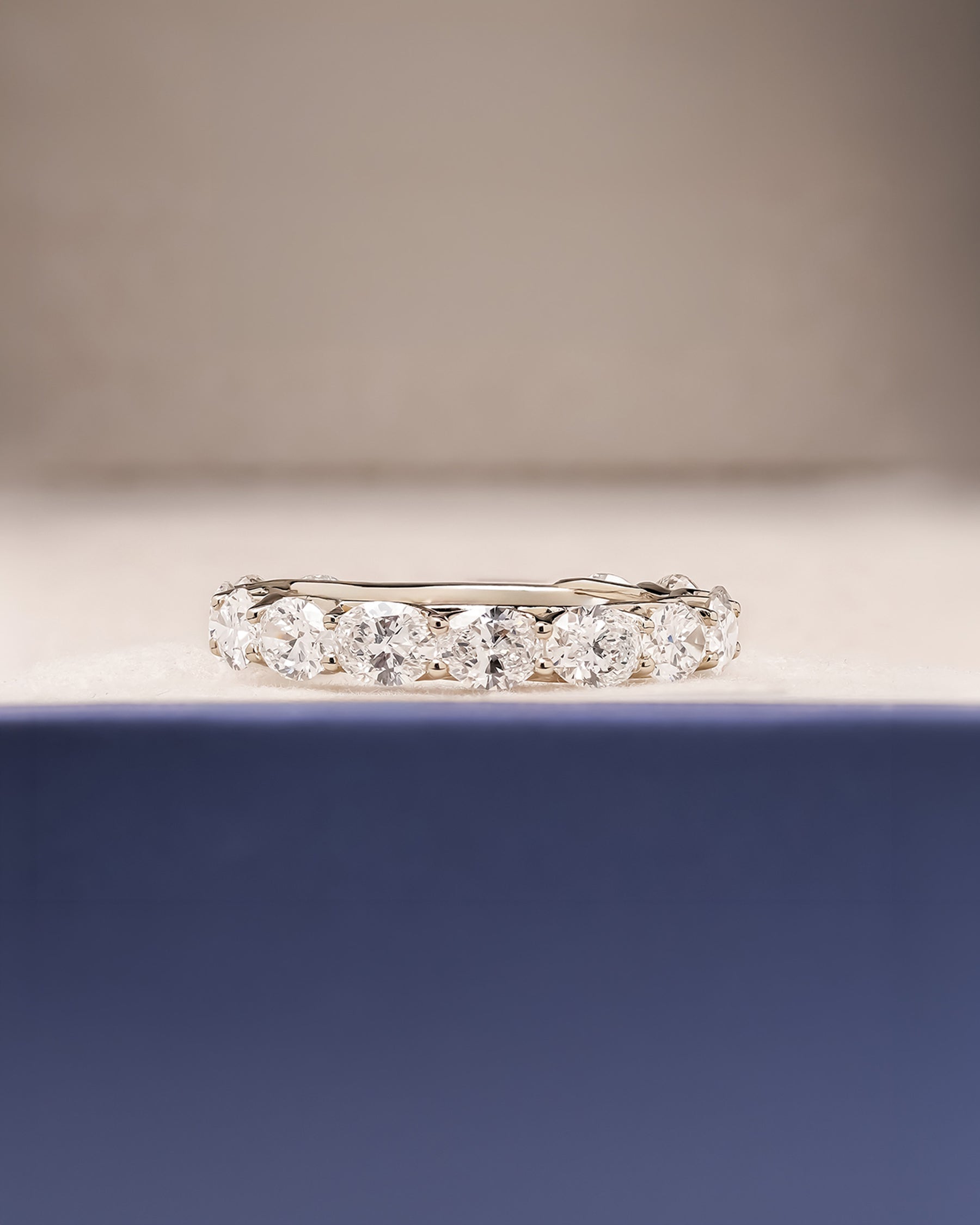 Margaux oval lab grown diamond eternity band in white gold inside Ronora box