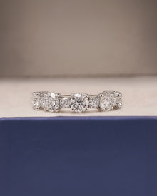 Close-up view of round lab grown diamond eternity band showing eternity setting