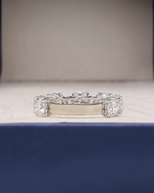 round lab grown diamond eternity band worn on hand in white gold