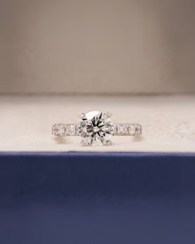 Nadia round lab grown diamond side-stone ring in white gold inside Ronora box