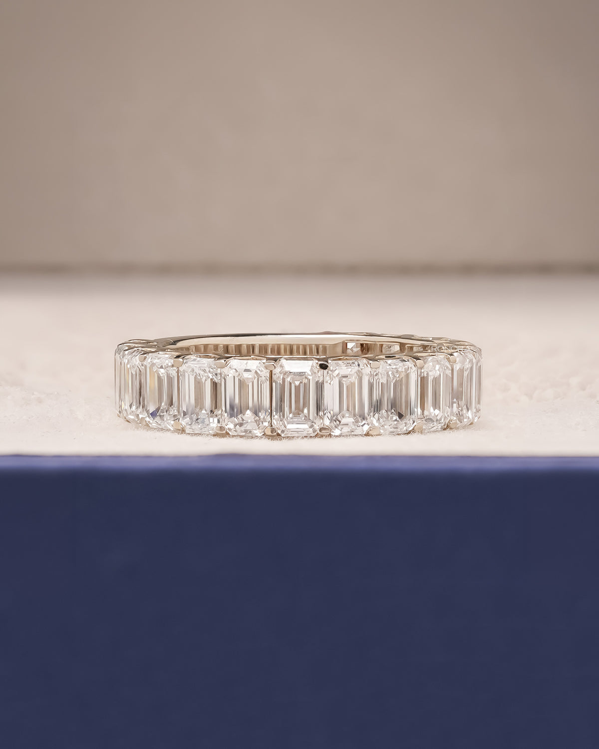 Sorelle emerald lab grown diamond eternity band in white gold inside Ronora box