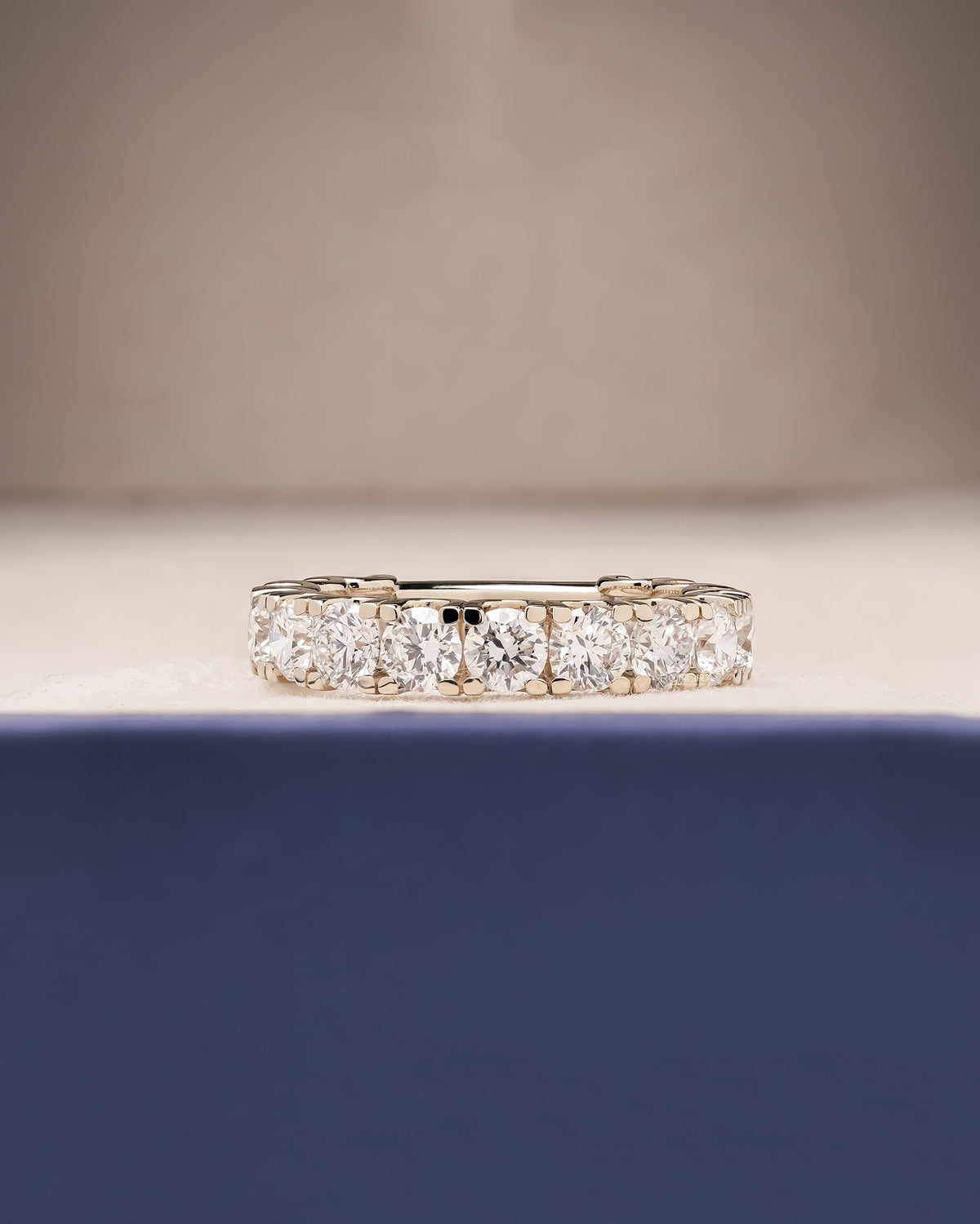 Elowen round lab grown diamond eternity band in white gold inside Ronora box