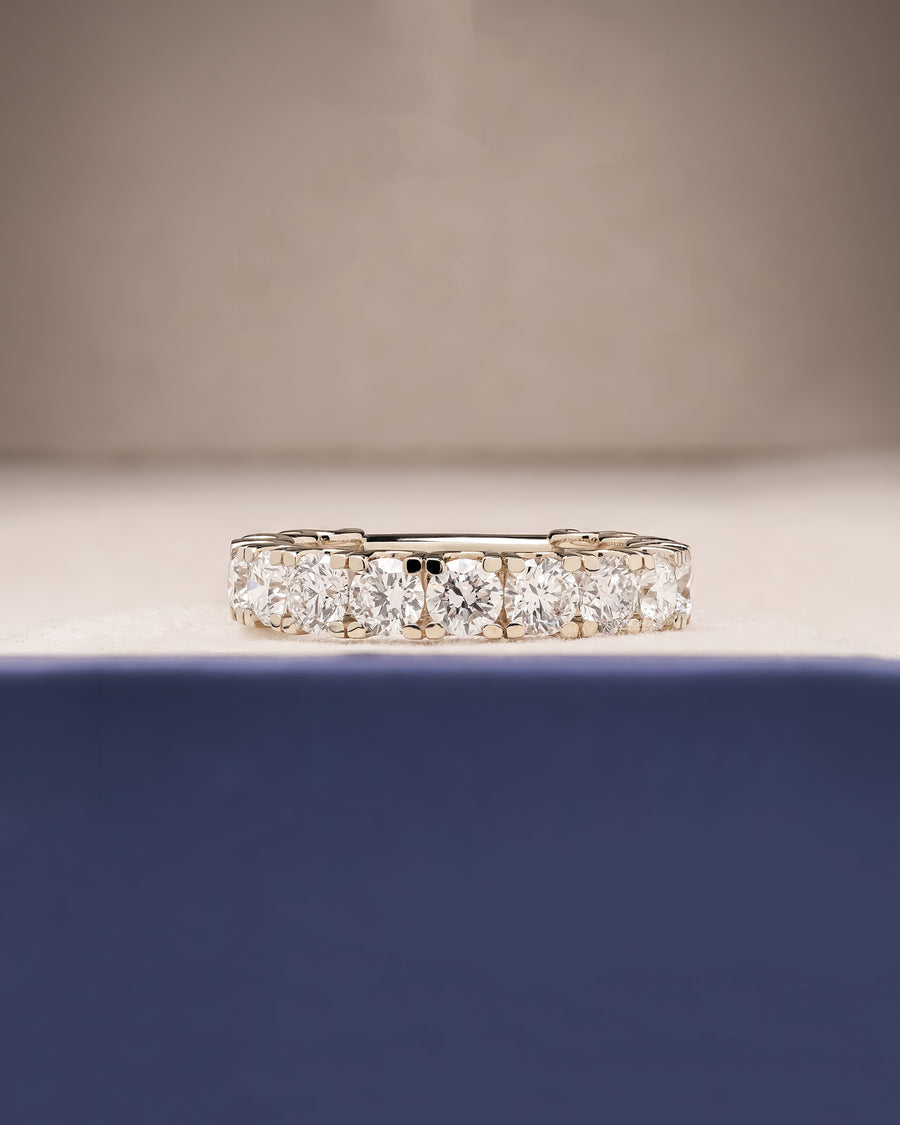 Elowen round lab grown diamond eternity band in white gold inside Ronora box