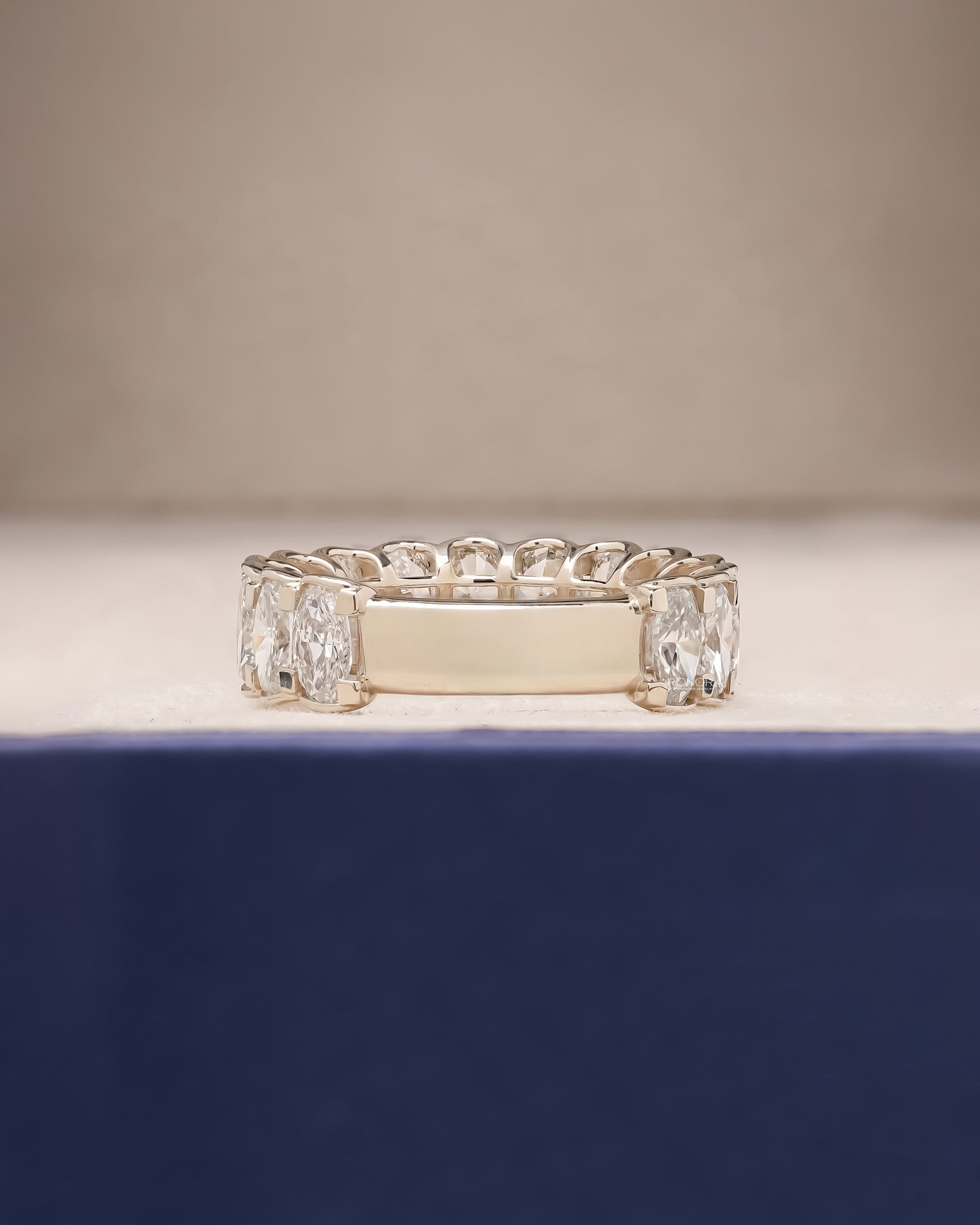 Side profile of oval lab grown diamond eternity band showing ring setting