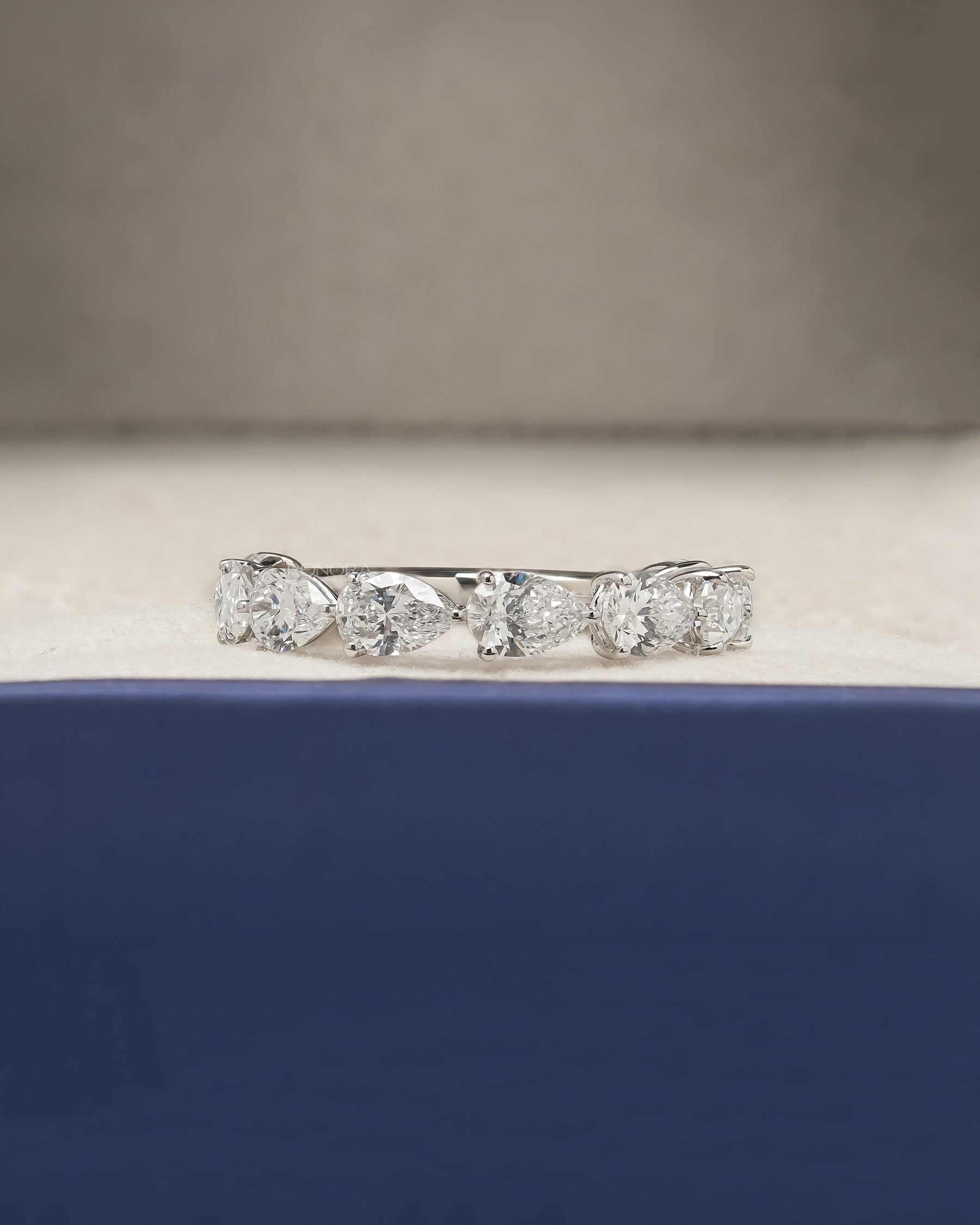 Sylvie pear lab grown diamond eternity band in white gold inside Ronora box