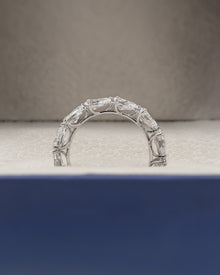 Angled view of pear lab grown diamond eternity band with eternity setting