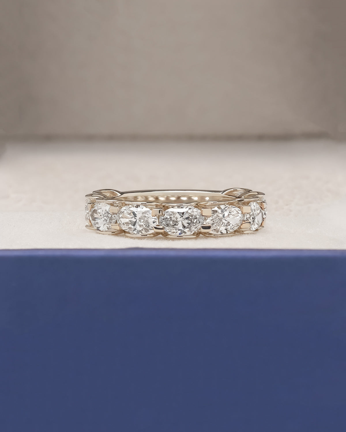Marina oval lab grown diamond eternity band in yellow gold inside Ronora box