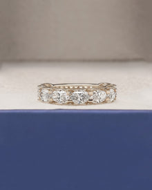 Marina oval lab grown diamond eternity band in yellow gold inside Ronora box