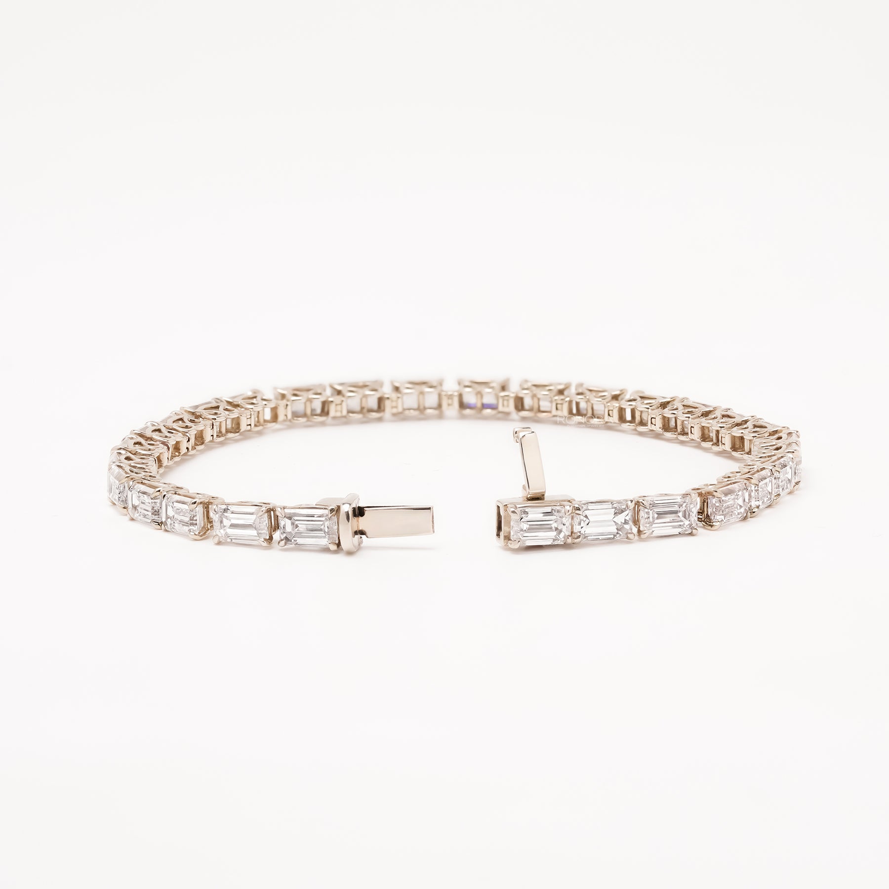 Open emerald lab grown diamond tennis bracelet with clasp