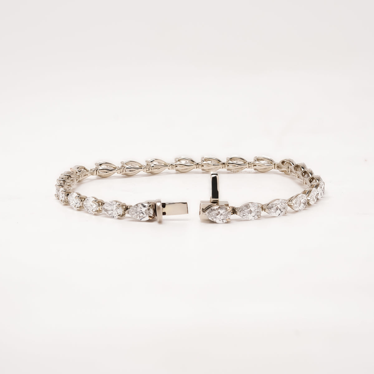 Open pear lab grown diamond tennis bracelet with clasp