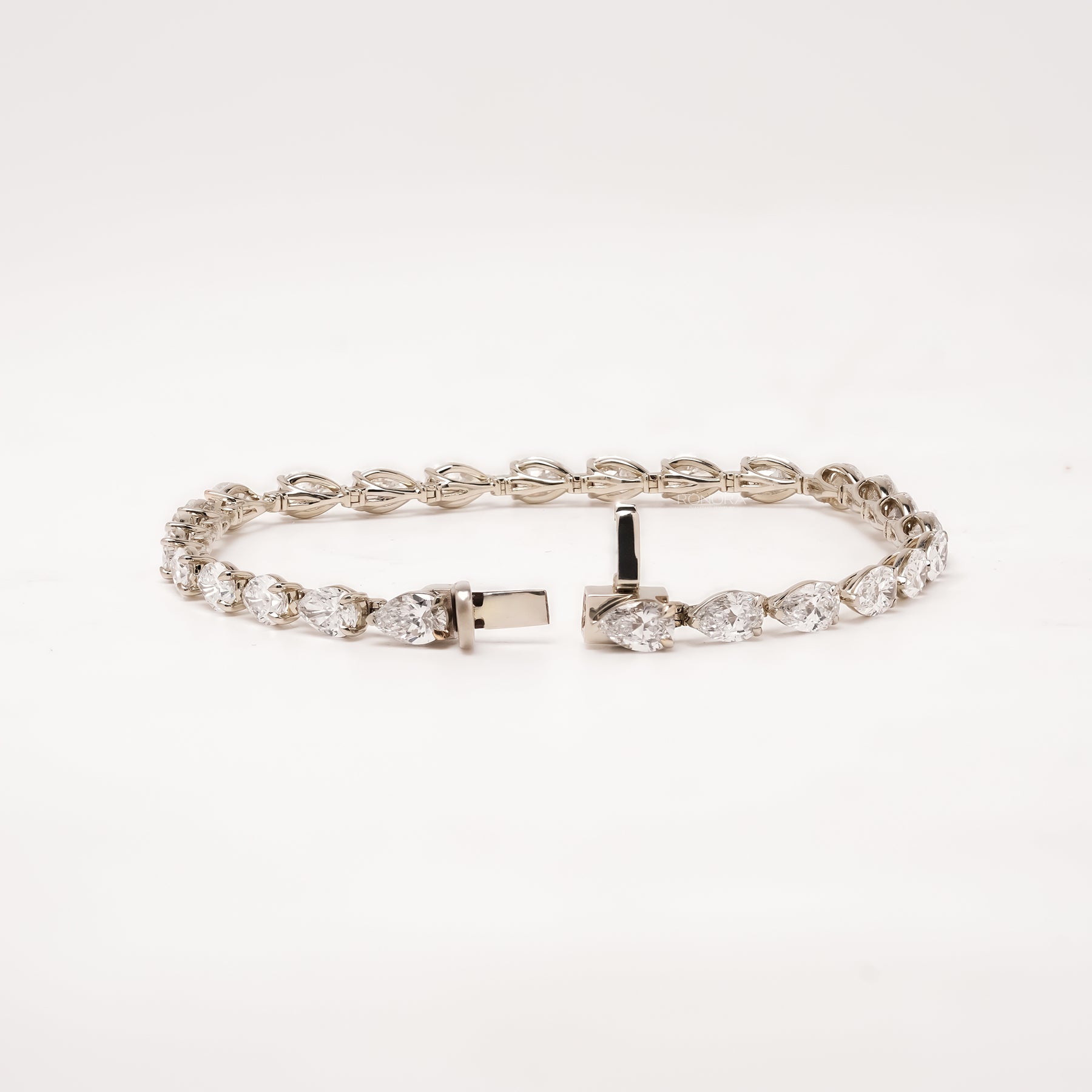 Open pear lab grown diamond tennis bracelet with clasp
