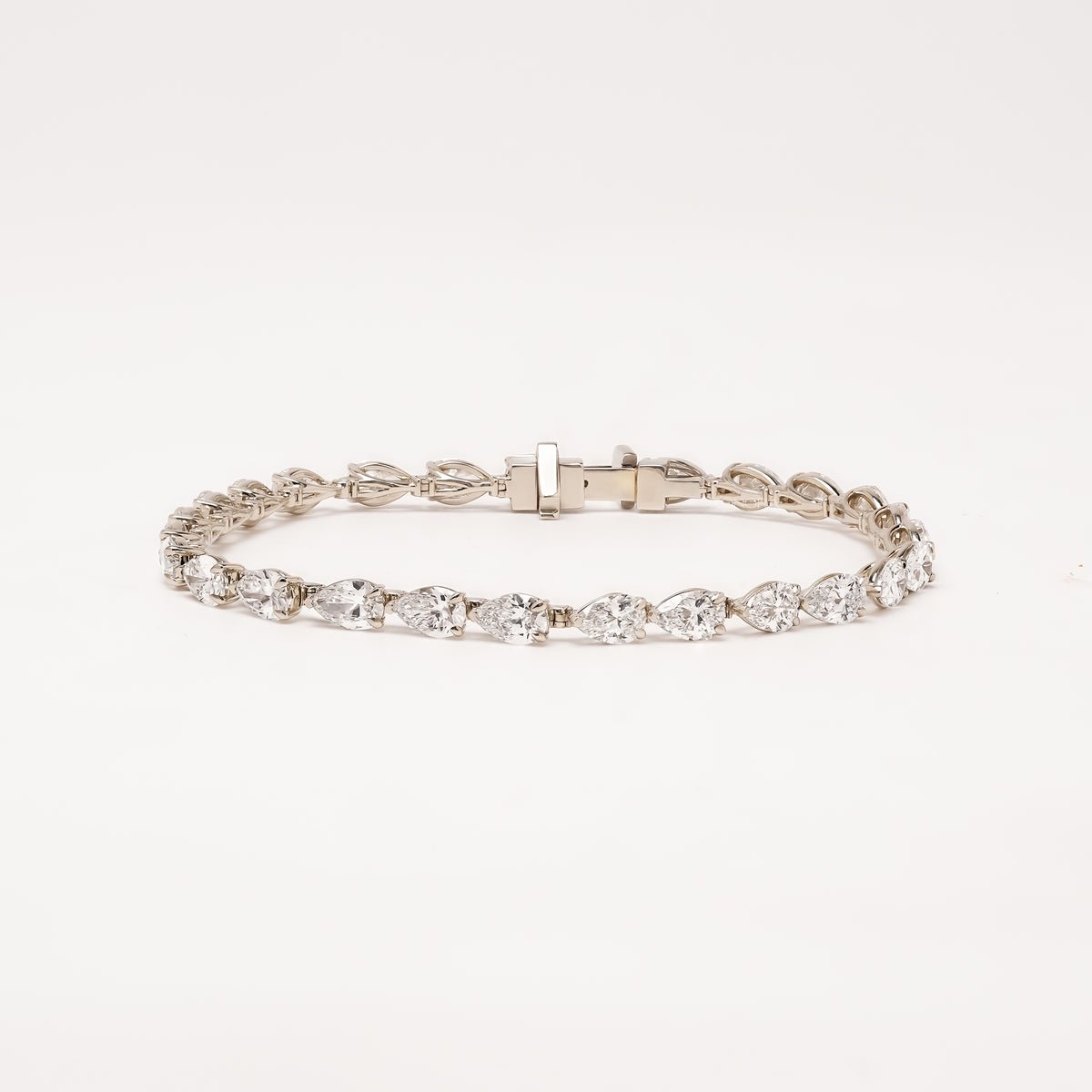 Caliane pear lab grown diamond tennis bracelet on white background